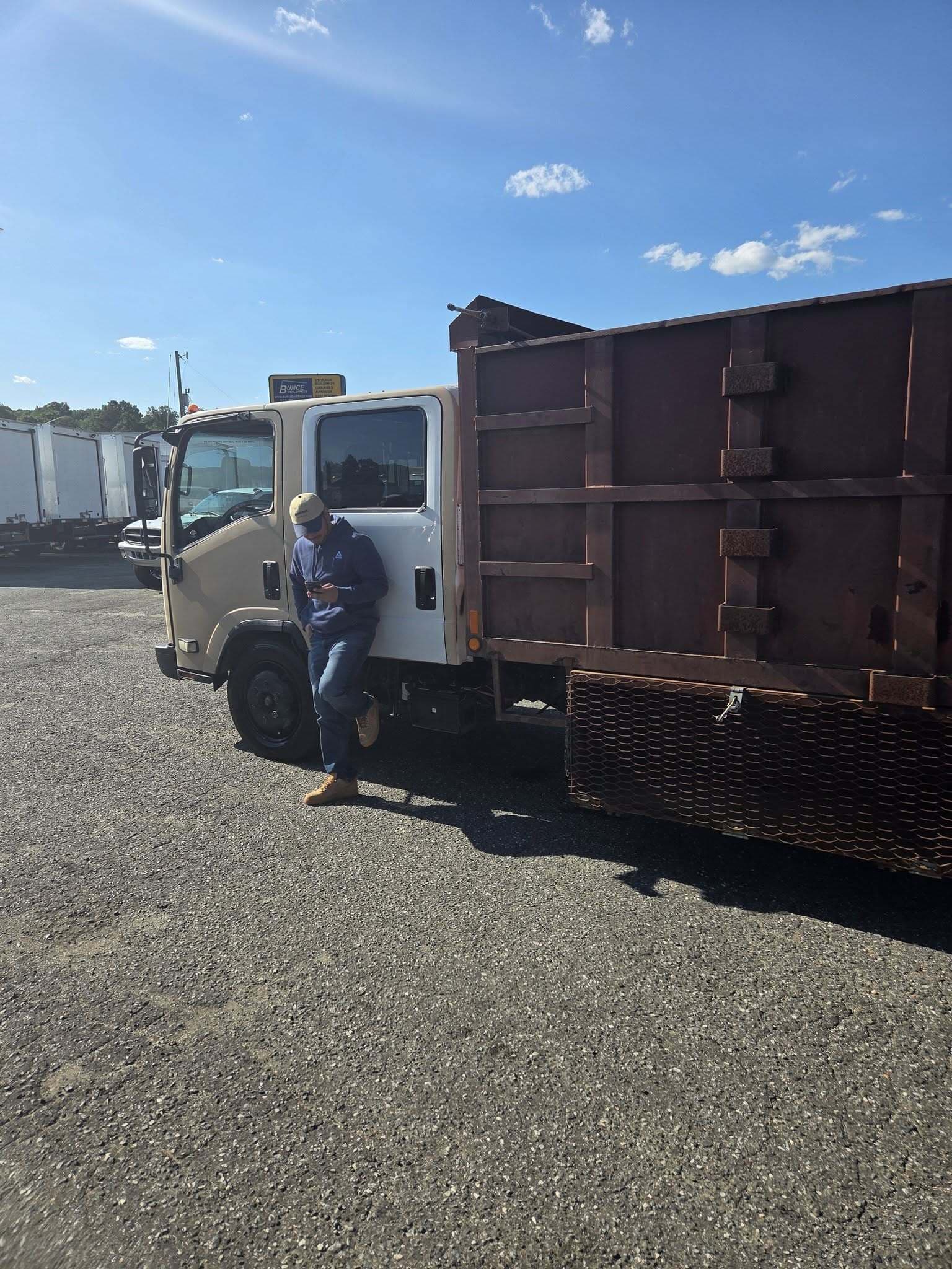 Got Junk NC crew member with the dump truck before a junk removal job in Greenville, NC